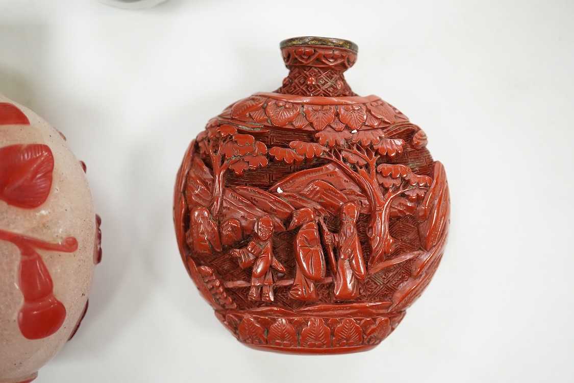 A Chinese cinnabar lacquer snuff bottle, a glass overlay snuff bottle and an underglaze copper red snuff bottle-9cm high (3)